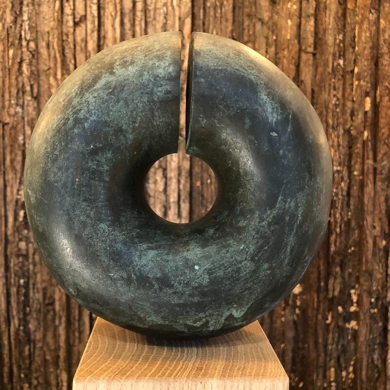 bronze sculpture in the shape of a ring , by Belgian artist Frans Claes