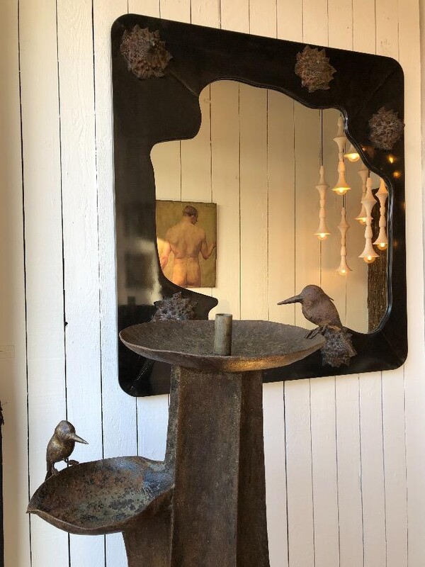 large sculptural mirror , brass frame and bronze shells applications