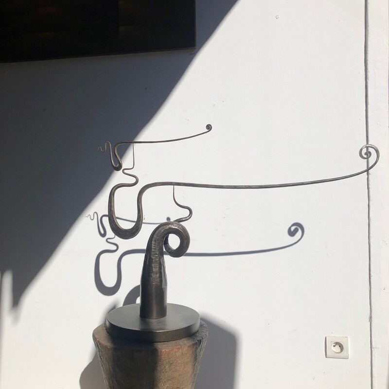 mobile with pendulum in wrought iron