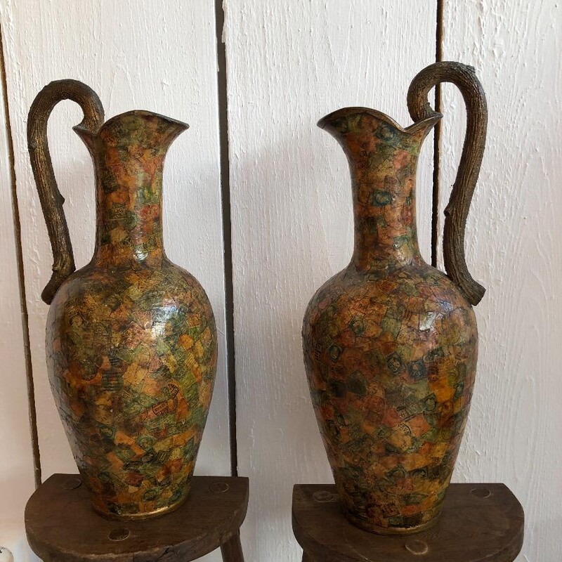 pair of terracotta vases or jugs , decorated with old postage stamps