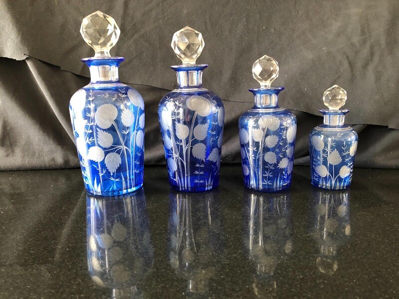 set of four stoppered crystal bottles , Baccarat or Saint-Louis crystal